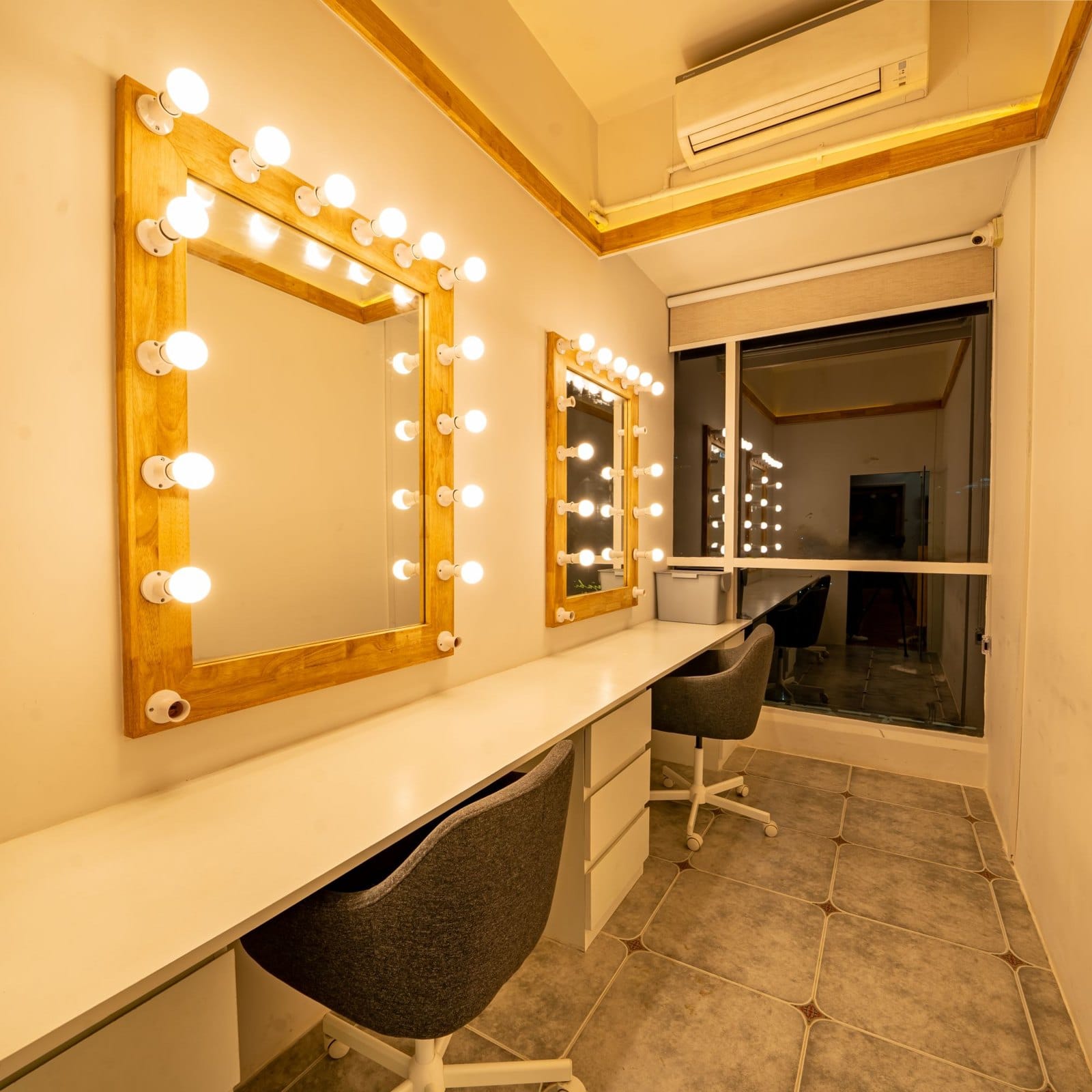 Make-up room with two lit mirrors