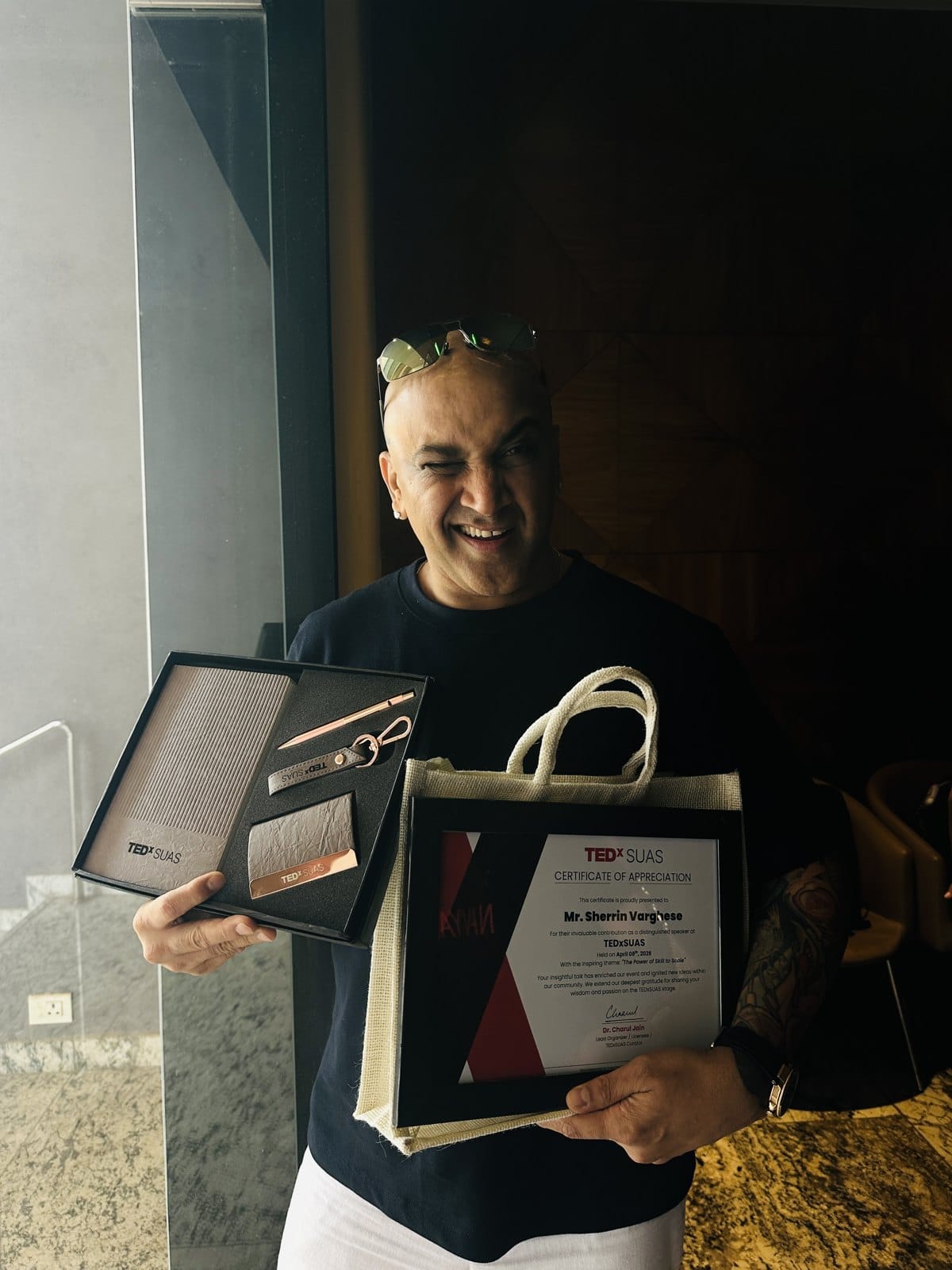 Sherrin Varghese with the TEDxSUAS certificate of appreciation